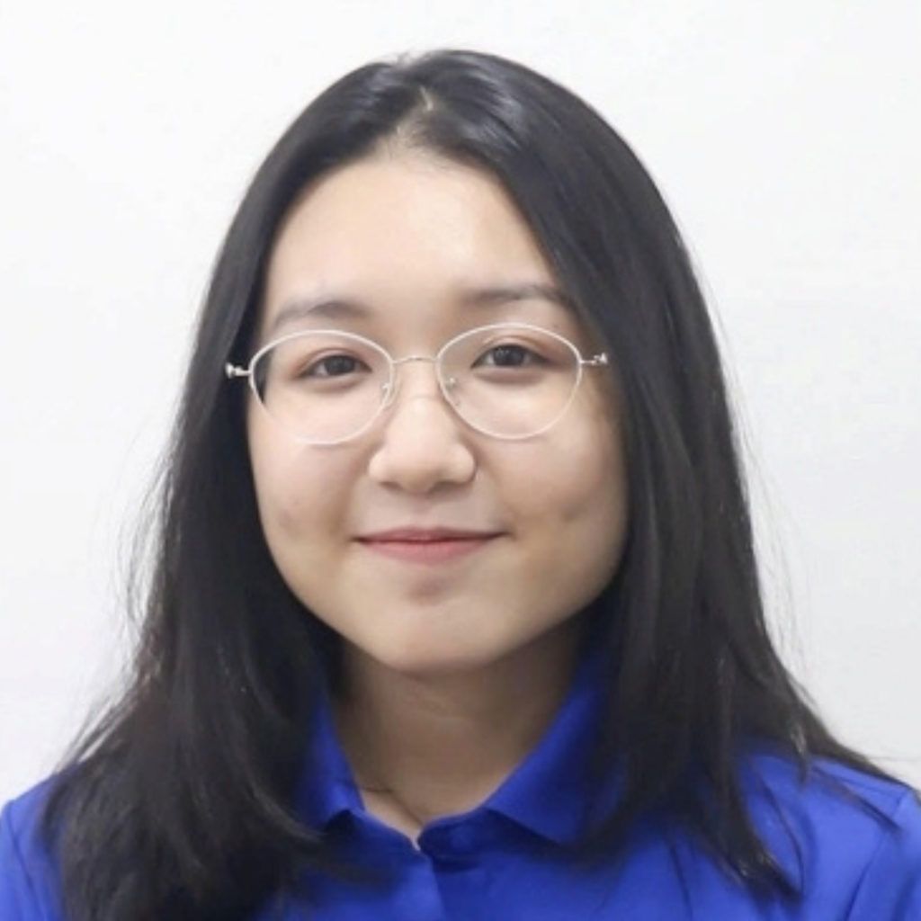 Headshot of Tran, a Greenville Technical College student, wearing glasses and a blue collared shirt and smiling at the camera.